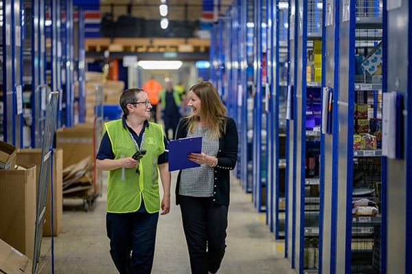 Warehouse workers discussing